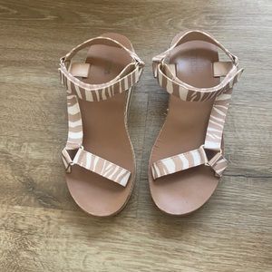 Tan and white sandals